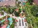 Resort-style pool and amenity area with water features, lounge chairs, and playground at 702 Calabria Ave, Davenport, FL 33897