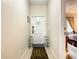 Inviting entryway with tile flooring and shoe storage at 702 Calabria Ave, Davenport, FL 33897