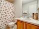 Clean bathroom with shower and seashell-themed decor at 702 Calabria Ave, Davenport, FL 33897