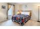 Charming bedroom with floral bedding and a window at 702 Calabria Ave, Davenport, FL 33897