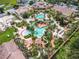 Aerial view of community pool and surrounding buildings at 702 Calabria Ave, Davenport, FL 33897
