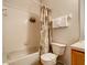 Neat bathroom with shower/tub and wood vanity at 702 Calabria Ave, Davenport, FL 33897