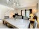 Bright dining room featuring a large farmhouse table and chandelier at 702 Calabria Ave, Davenport, FL 33897