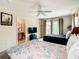 Main bedroom with a king-size bed and access to bathroom at 702 Calabria Ave, Davenport, FL 33897