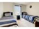 Cozy bedroom with two twin beds, nightstand, and window at 702 Calabria Ave, Davenport, FL 33897