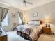 Spacious bedroom with a comfortable bed and plenty of natural light at 702 Calabria Ave, Davenport, FL 33897