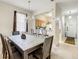 Dining room with kitchen views, chandelier, and a table perfect for Gathering meals at 702 Calabria Ave, Davenport, FL 33897