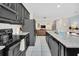 Modern kitchen with granite countertops and stainless steel appliances at 1616 Carey Palm Cir, Kissimmee, FL 34747