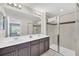 Clean bathroom with double vanity and glass shower at 1616 Carey Palm Cir, Kissimmee, FL 34747
