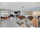 Open living area with leather couches and a glass coffee table at 1616 Carey Palm Cir, Kissimmee, FL 34747