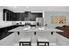 Modern kitchen with island, stainless steel appliances, and granite countertops at 1616 Carey Palm Cir, Kissimmee, FL 34747