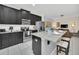 Modern kitchen with stainless steel appliances and granite countertops at 1616 Carey Palm Cir, Kissimmee, FL 34747