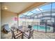 Private pool area with patio furniture at 1616 Carey Palm Cir, Kissimmee, FL 34747
