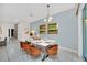 Elegant dining room with a modern table and six chairs at 1616 Carey Palm Cir, Kissimmee, FL 34747