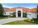 House exterior featuring a tile roof and driveway at 7487 Gathering Dr, Reunion, FL 34747