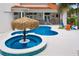 Resort-style pool and spa with tiki bar and lounge chairs at 7487 Gathering Dr, Reunion, FL 34747