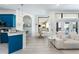 Modern kitchen boasts teal cabinets, white countertops, and stainless steel appliances at 7487 Gathering Dr, Reunion, FL 34747