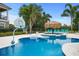 Relaxing pool area with a spa, basketball hoop, and lounge chairs at 7487 Gathering Dr, Reunion, FL 34747