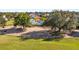 Community view showcasing a clubhouse and golf course at 7487 Gathering Dr, Reunion, FL 34747