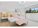 Spacious bedroom with a plush bed and soft decor at 7487 Gathering Dr, Reunion, FL 34747
