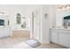 Spa-like bathroom with soaking tub, shower, and double vanity at 7487 Gathering Dr, Reunion, FL 34747
