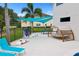 Outdoor patio with games like ping pong, giant Jenga, and cornhole at 7487 Gathering Dr, Reunion, FL 34747