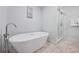 Relaxing bathroom with a soaking tub and shower at 7487 Gathering Dr, Reunion, FL 34747