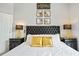 Elegant bedroom with a king-size bed and gold accents at 7487 Gathering Dr, Reunion, FL 34747