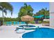Enjoy the refreshing pool and spa with lounge chairs at 7487 Gathering Dr, Reunion, FL 34747