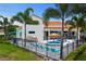 Two-story house with a pool and tropical landscaping at 7487 Gathering Dr, Reunion, FL 34747