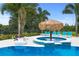 Stunning pool and spa with a unicorn floatie at 7487 Gathering Dr, Reunion, FL 34747
