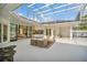 Lush patio with covered seating area and pool view at 9217 Hidden Bay Ln, Orlando, FL 32819