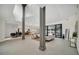 Open living area with modern furniture, high ceilings, and pool view at 9217 Hidden Bay Ln, Orlando, FL 32819