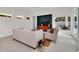Spacious living room with comfortable seating and access to the pool at 9217 Hidden Bay Ln, Orlando, FL 32819