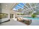 Spacious pool and patio area with covered seating and pool at 9217 Hidden Bay Ln, Orlando, FL 32819