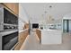 Open concept kitchen with marble island and stainless steel appliances at 9217 Hidden Bay Ln, Orlando, FL 32819