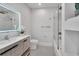 Modern bathroom with a soaking tub, walk-in shower, and double vanity at 9217 Hidden Bay Ln, Orlando, FL 32819