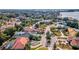 Aerial view of a neighborhood highlighting a home with a circular driveway and pool at 9217 Hidden Bay Ln, Orlando, FL 32819