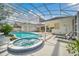 Relaxing pool and spa area with covered patio at 9217 Hidden Bay Ln, Orlando, FL 32819