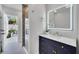 Spa-like bathroom with walk-in shower and marble finishes at 9217 Hidden Bay Ln, Orlando, FL 32819