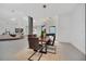 Elegant dining room with a wood table and modern lighting at 9217 Hidden Bay Ln, Orlando, FL 32819