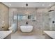Bathroom with freestanding tub and marble shower at 9217 Hidden Bay Ln, Orlando, FL 32819