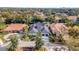 Aerial view of a luxury home with a large, covered pool at 9217 Hidden Bay Ln, Orlando, FL 32819