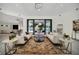 Open concept living space with large windows, pool view, and stylish decor at 9217 Hidden Bay Ln, Orlando, FL 32819