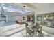 Covered patio with seating area and view of the pool at 9217 Hidden Bay Ln, Orlando, FL 32819