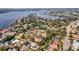 Aerial view showcasing a neighborhood's waterfront location and upscale homes at 9217 Hidden Bay Ln, Orlando, FL 32819
