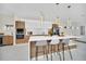 Modern kitchen with large island, stainless steel appliances, and light wood cabinets at 9217 Hidden Bay Ln, Orlando, FL 32819