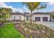 Modern two-story house with a three-car garage and landscaped yard at 9217 Hidden Bay Ln, Orlando, FL 32819