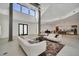 Bright living room with high ceilings, large windows, and modern decor at 9217 Hidden Bay Ln, Orlando, FL 32819