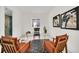 Home office with glass desk and comfortable chairs at 9217 Hidden Bay Ln, Orlando, FL 32819